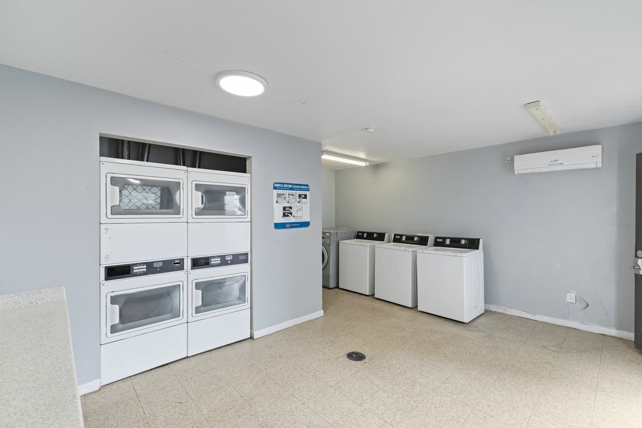 Waverly community laundry room with washers and dryers