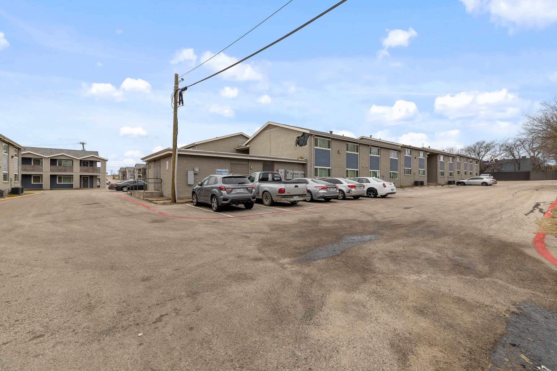 On-site parking beside the residential buildings at Waverly Apartments